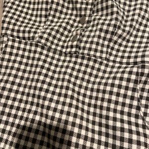 A checkered dress with buttons and zips